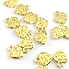 heart shaped gold jewelry charms with the words made with love on them, on a hand to show scale Handmade Projects, Heart Shaped Jewelry, Jewelry Charms, Love Charms, Gold Colour, Made With Love, Charm Jewelry, Easy Crafts, Heart Shapes