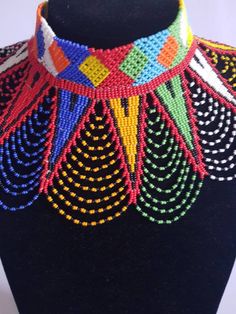 This shoulder necklace is made using colorful fine beads. Perfect for weddings or African themed events. **Buy multiple items and pay shipping for 1 item only.The rest ships free. More neckleces here; https://www.etsy.com/shop/TribalTess?ref=seller-platform-mcnav&section_id=21306083 Back to my shop; https://www.etsy.com/shop/TribalTess?ref=seller-platform-mcnav Handmade Multicolor Jewelry For Wedding, Wedding Multicolor Beaded Chain Beads, Bohemian Multicolor Beaded Necklaces For Wedding, White Beaded Choker For Festivals, Bohemian Multicolor Beaded Necklace For Wedding, Multicolor Beaded Bridal Necklace For Festivals, Multicolor Beaded Chain Necklace For Wedding, Bohemian Beaded Necklace For Wedding, Multicolor Beaded Bridal Necklace For Party