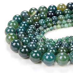 green and white beads are arranged together