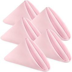 four pieces of pink cloth on top of each other in front of a white background