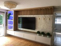 a large flat screen tv mounted to the side of a wall