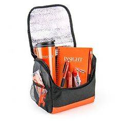 an orange and black lunch bag filled with school supplies