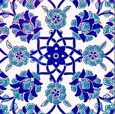 a blue and white tile with flowers on it