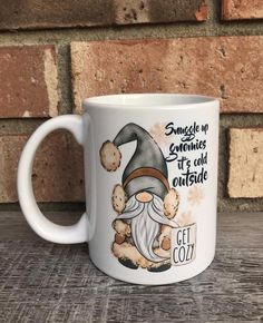 a white coffee mug with an image of a gnome on it and the words, smackle in sometimes if old outside get cozy