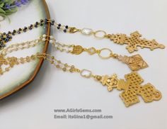 Brass Coptic Cross Necklace, White Turquoise Long Necklace, St. Benedict Religious Necklace, Ethiopian Cross Magnesite Rosary Chain Necklace By Regina Harp Designs. All of our necklaces are made with the highest quality Gold Filled jumped rings, clasps and components unless otherwise noted. This necklace features our Small Ethiopian Brass Cross with our St. Benedict Center and a CZ Quartz Connector on 6 mm Matte Magnesite Gold Plated Rosary Chain. This listing is for one Cross necklace in Pictur Bohemian Cross Beaded Necklace Gift, Gold Charm Necklaces With Gemstone Beads For Jewelry Making, Artisan Cross Jewelry For Jewelry Making, Artisan Cross Necklace For Jewelry Making, Gold Spiritual Beaded Necklace Nickel Free, Nickel-free Gold Beaded Necklace For Spiritual Wear, Artisan Gold Crystal Necklaces With Gemstone Beads, Artisan Gold Crystal Necklace With Gemstone Beads, Spiritual Gold Beaded Necklace Nickel Free