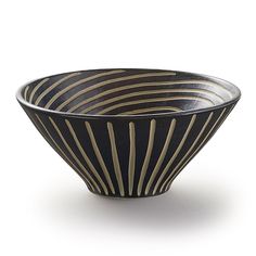 a black and gold striped bowl on a white background