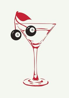 a martini glass with two olives in it and the number eight on top of it