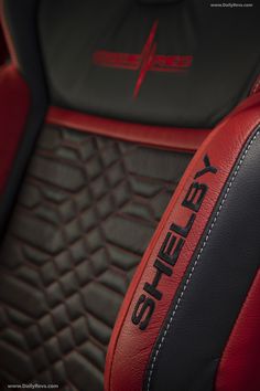 red and black leather seat covers with the word sheley on it