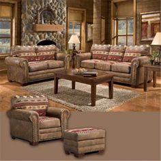 a living room with couches, chairs and a coffee table in front of a stone fireplace