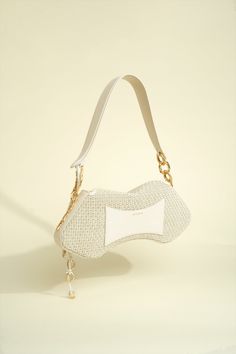 Shoulder bag in Woven Natural Raffia and Nappa Leather Trim and Hanging Organic Rings Luxury Shoulder Bag With Pearl Handle For Shopping, Designer Beige Shoulder Bag Fashion Accessory, Luxury Clutch Shoulder Bag For Errands, Luxury Tote Shoulder Bag With Pearl Handle, Elegant Straw Bag With Gold-tone Hardware For Daily Use, Elegant Straw Bag With Gold-tone Hardware For Everyday Use, Elegant Everyday Straw Bag With Gold-tone Hardware, Luxury Rectangular Baguette Bag As Fashion Accessory, Luxury Rectangular Straw Bag With Detachable Strap