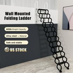 a black metal stair case next to a wall mounted folding ladder sign with ustock stickers on it