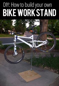 a bike is mounted to the side of a pole with text overlay that reads, diy how to build your own bike work stand