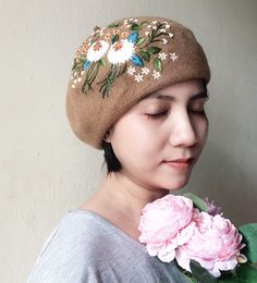 Material: felt, embroidery threads. Size: one size fits most for women. Color: as photo shows ❤ Have you got a gift idea for your daughter, girlfriend, best friend? => Pretty hand-embroidered beret is a good suggestion. - Affordable price, good quality, lovely. - Give yourself or someone you love this as a meaningful gift. With meticulous and delicate hand-embroidered motifs, it makes you look more outstanding and beautiful. It is suitable for going out, going to school, party... ❤ Care instruct Beige Hat For Gift, Beige Hat As Gift, Handmade Hats For Fall Gifts, Handmade Whimsical Felt Hat For Winter, Handmade Hats As Spring Gifts, Spring Embroidered Hat For Gift, Whimsical Mini Hat With Handmade Flowers, Handmade Mini Hats For Winter Gifts, Handmade Mini Hats As Winter Gifts