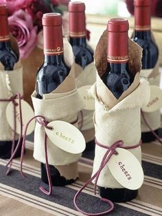 wine bottles wrapped in burlocks with tags