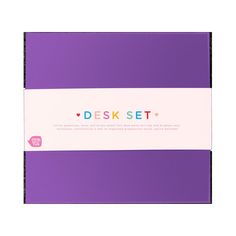 the desk set is purple and has a white stripe on it, with pink lettering