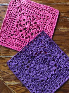 two crocheted squares sitting on top of a wooden table