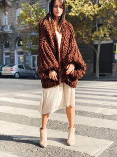 "This brown maxi coat is warm, oversize and very popular among our customers. Chunky knit sweater for women. This crochet cardigan is long and has long sleeves. This elegant, soft and warm chunky cardigan is made of wool blend yarn. Wool cardigan open in front, loose fit. The coat is very practical. The front of the coat is open, so if you want, you can close on special buttons. The knitted cardigan is comfortably light, very soft and super cozy. Since the material is very high quality wool yarn Oversized Cable Knit Acrylic Outerwear, Oversized Acrylic Knit Cardigan, Oversized Chunky Knit Sweater Coat In Acrylic, Oversized Acrylic Sweater Coat With Chunky Knit, Oversized Chunky Knit Acrylic Sweater Coat, Slouchy Chunky Knit Cardigan For Fall, Slouchy Chunky Knit Fall Cardigan, Oversized Open Front Chunky Knit Sweater, Oversized Knitted Outerwear