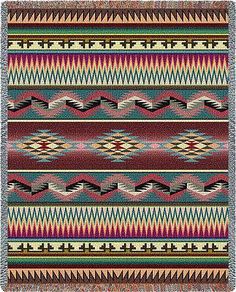 a multicolored blanket with fringes and designs on the front, in various colors