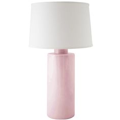 a pink table lamp with a white shade