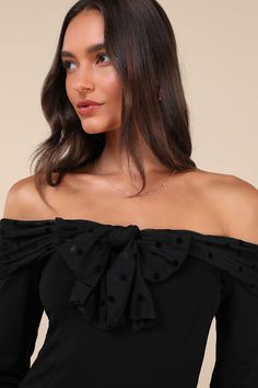 You'll be the center of attention in any room when you're wearing the Lulus Major Charisma Black Off-the-Shoulder Bow Long Sleeve Top! Stretchy ponte knit shapes this flattering top that has long sleeves and an off-the-shoulder neckline with a mesh-style overlay that has tonal velvet polka dots and forms a bow at the front. Fitted bodice continues down to a lightly cropped hem. Fit: This garment fits true to size. Length: Size medium measures 15" from top to bottom. Bust: Great for any cup size. Fitted Black Off-shoulder Top, Black Fitted Off-shoulder Top, Chic Cold Shoulder Off-shoulder Top For Party, Black Long Sleeve Off-shoulder Party Top, Black Long Sleeve Off-shoulder Top For Party, Fitted Off-shoulder Top For Party, Fitted Off-shoulder Top For Fall Party, Cold Shoulder Off-shoulder Top For Evening, Elegant Fitted Off-shoulder Top For Party