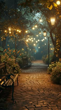 a park bench sitting on top of a cobblestone road next to trees and lights