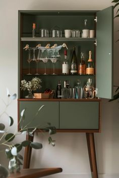 Explore chic modern bar cabinet ideas to stylishly enhance your home entertaining space. This pin showcases 1 engaging image highlighting diverse bar cabinet designs perfect for any home.