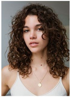 7 Exfoliators That Are Basically as Good as Microdermabrasion #long #curly #hair #with #fringe Get facial-like results, right in the comfort of your own home Long Curly Hair With Fringe, Curly Hair With Fringe, Hair With Fringe, Curly Hair Fringe, Woman With Curly Hair, Layered Curly Hair, Curly Hair Photos