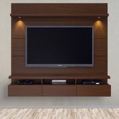 a flat screen tv mounted to the side of a wooden entertainment center in a living room