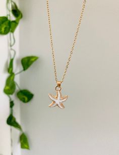 This necklace is so beautiful, looks great with anything, and is perfect for a Beachy look! White Chain Long Necklace As Gift, White Long Chain Necklace Gift, White Long Chain Necklace As Gift, White Chain Long Necklace For Gift, Dainty Necklace With Delicate Chain For Beach, Elegant Starfish Necklace For Gift, Dainty Beach Necklace With Delicate Chain, Dainty Clavicle Chain Necklace For Beach, Elegant Beach Pendant Charm Necklaces