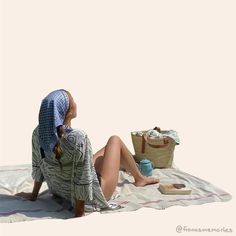 a woman sitting on top of a blanket next to a bag