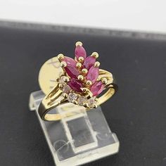 Look at this stunning 14k gold ring with  genuine rubies and diamonds. This ring is perfect for any occasion gift box included. Let us know your size  Hermoso anillo todo en oro 14k con rubies genuinas y diamantes. Este anillo esta perfecto para toda ocasion. Incluimos una cajita de regalo. Dejenos saber su medida Cluster Ruby Rings With Diamond Accents, Ruby Cluster Rings With Diamond Accents, Red Cluster Diamond Ring In 14k Gold, Red Diamond Cluster Ring In 14k Gold, 14k Gold Ruby Ring With Cluster Setting, Yellow Gold Cluster Ruby Promise Ring, Yellow Gold Ruby Cluster Ring For Promise, Fine Jewelry Red Diamond Ring Stamped 14k, 14k Gold Red Diamond Ring With Accents