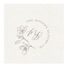 the modern bloom co logo with flowers on it's back and handwritten lettering