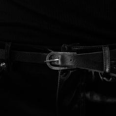 The product in question is a black leather belt with a silver buckle.The belt features a series of small crosses engraved on the surface of the buckle, which create a unique and distinctive design.The black leather is of high quality and guarantees resistance and durability over time, while the buckle is in 925% silver, robust and resistant to corrosion.The combination of these two materials creates an elegant and sophisticated contrast, which fits perfectly with formal or casual wear. This belt Black Leather Belt With Buckle Closure, Black Belt With Buckle Closure, Black Business Belts With Buckle Closure, Black Buckle Belts For Business, Black Business Belt With Buckle Closure, Black Adjustable Belt With Silver Buckle, Adjustable Black Belts With Silver Buckle, Adjustable Black Belt With Silver Buckle, Black Leather Belt Buckles With Silver Buckle