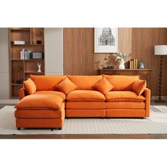 an orange sectional sofa in a living room