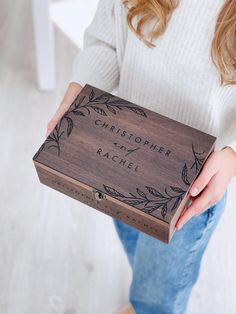 a woman holding a personalized wooden box