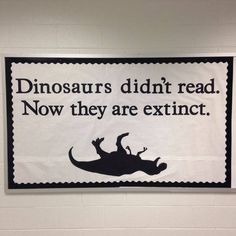 a black and white sign that says dinosaurs didn't read now they are extinct