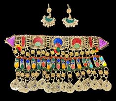 Afghan traditional Kuchi style jewelry including necklace and earing. Traditional Silver Dangle Jewelry Sets, Traditional Beaded Jewelry For Festival, Motif Jewelry For Celebrations, Bohemian Jewelry With Traditional Patterns As Gift, Bohemian Jewelry For Ceremonial Festival, Bohemian Festival Jewelry For Ceremonial Occasions, Festive Beaded Jewelry For Festival, Traditional Jewelry Sets With Motifs For Festive Season, Traditional Necklaces For Festivals