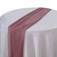 the table is covered with a pink and white cloth