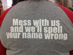 the back of a woman's shirt that says mess with us and we'll spell your name wrong