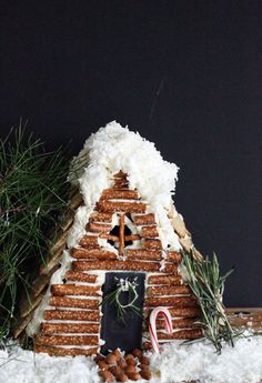 a gingerbread house made out of cookies and marshmallows