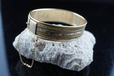 This is the perfect option for those who like cool, unique jewelry and the luxury, shine of gold. This bracelet is well made, cute and/or elegant in design, and very desirable. The bracelet is opened. The bracelet is decorated with floral pattern. It has a secure chain. The clasp is in perfect working condition. ♥ Age/era: Circa 1970s - 1980s. ♥ There is no hallmark. There is monogram L.D. ♥The bracelet is gold filled. ♥ The bracelet is about 2 1/4 inches by 1 3/4 inches. ♥The bracelet is for sm Vintage Bangle Chain Bracelet As Gift, Elegant Rectangular Engraved Gold Bracelet, Elegant Rectangular Engraved Bracelets, Elegant Engraved Rectangular Bracelets, Gold Rectangular Cuff Bracelet Gift, Gold Rectangular Bangle Gift, Flower Monogram, Design Flower, Deco Jewelry