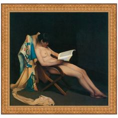 a nude woman sitting in a chair reading a book