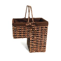 two wicker baskets with brown linings and handles, one is holding a purse