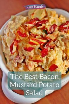 the best bacon mustard potato salad in a white bowl on a wooden table with text overlay