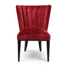 a red velvet chair with black legs