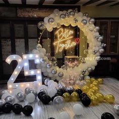 balloons and lights decorate the entrance to a 21st birthday party