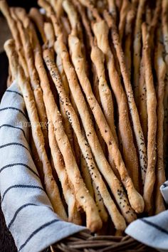 bread sticks in a basket on a table