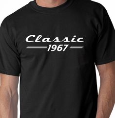 a man wearing a black t - shirt with the words classic 1953 printed on it