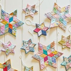 several colorful stars are hanging on the wall