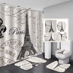 a shower curtain with the eiffel tower in paris printed on it and matching rugs